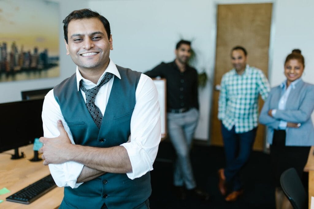 Man in White Dress Shirt and Necktie Smiling